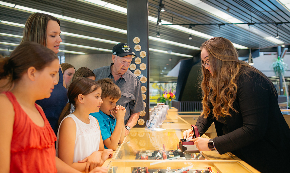 Photo of people shopping at the Winnipeg Mint Boutique. Photo of people shopping at the Winnipeg Mint Boutique.