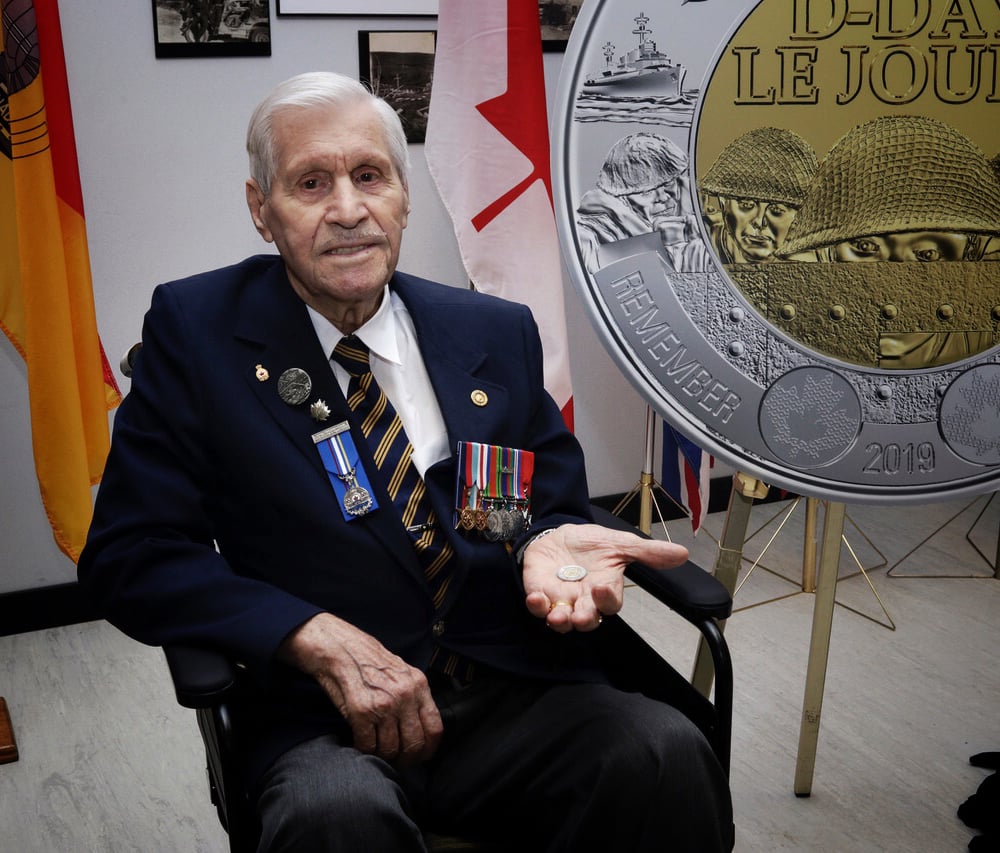 Alphonse Vautour was the first Canadian to receive the coin that  features the image of soldiers peering out from their landing craft – a scene that Vautour experienced and can vividly recall.