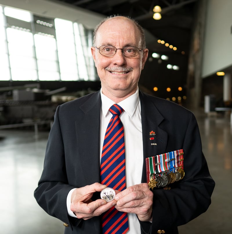 When the Royal Canadian Mint first called retired Military Engineer Warrant Officer Ed Storey, CD asking him to be a historical advisor on a military coin, he knew his lifelong “pack rat” tendency had finally found its purpose. He believes it’s important to remember Canada’s sacrifices and achievements, and that realistic, accurate details on coins can help draw people in and give the depicted events a kind of immediacy. The 2020 Fine Silver Proof Dollar honouring the 75th anniversary of V-E Day is a great example of that, placing those who fought on the front lines in the spotlight while also drawing the viewer into the celebratory scene behind them. It’s that party atmosphere that resonates most with Storey.
