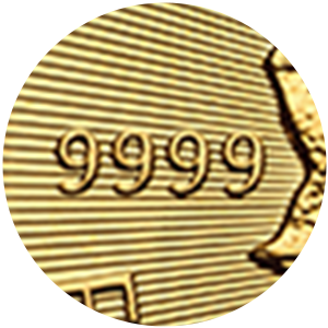Close up of gold coin showing mark of 99.99% pure gold, 9999.