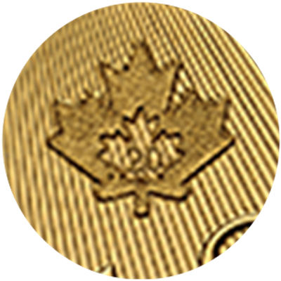 Close up of gold coin, privy mark of a maple leaf.